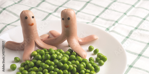 Принти на полотні Menu for children. frankfurter with eyes and a smile. Octopus fr