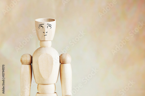 Man with an empty head. Abstract image with wooden puppet