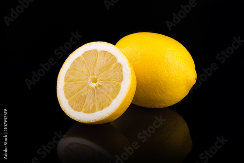 Ripe lemons. Isolated on black background