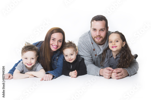 attractive portrait of young happy family over white background