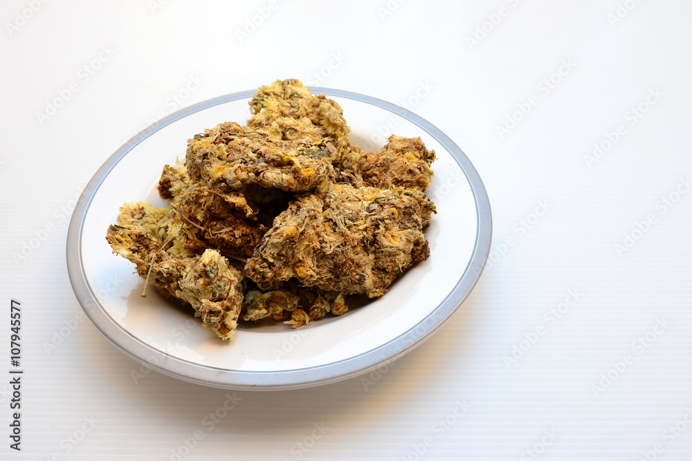 Dried chrysanthemum flowers in dish Dried chrysanthemum flowers in dish