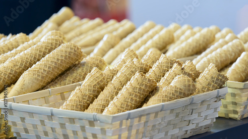 stacked wafer ice cream cones in basket