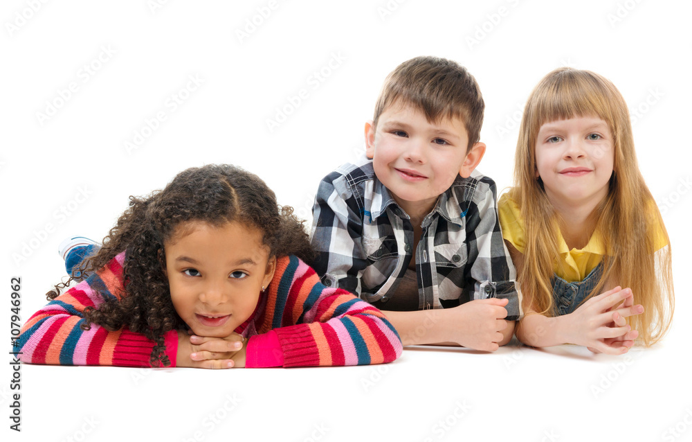 tree cute children lying on the floor in a studio tree cute children lying on the floor in a studio