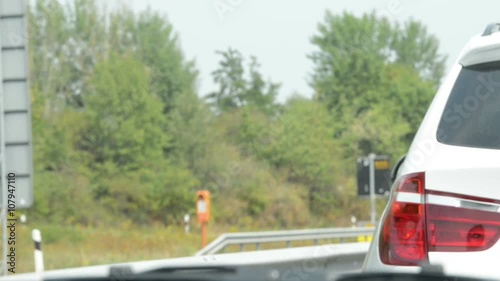 Wallpaper Mural Traffic jam on A2 motorway close to Braunschweig. slow driving on both traffic lanes. in front direction sign for road B1 towards  Torontodigital.ca