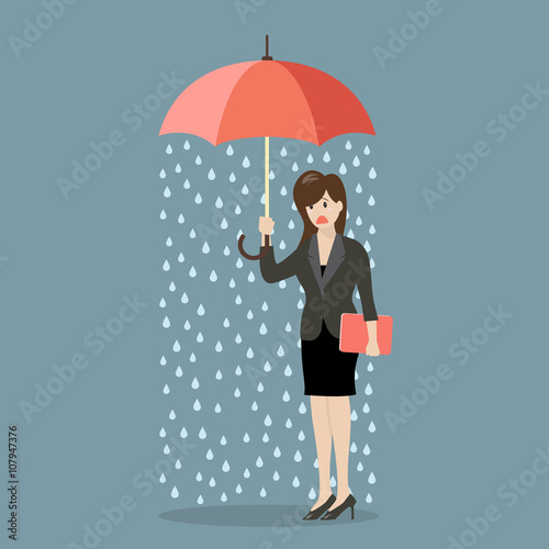 Business woman being wet from raining instead she holding umbrel