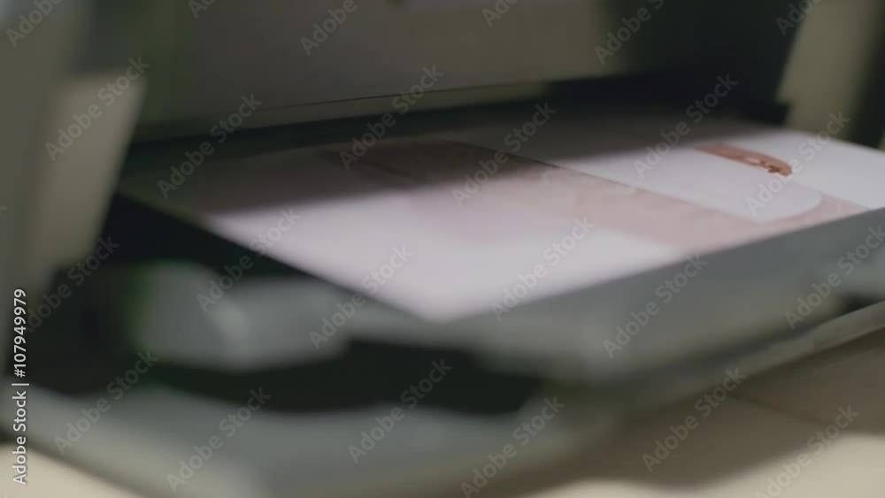 Close-up of fashion photograph being printed Close-up of fashion photograph being printed