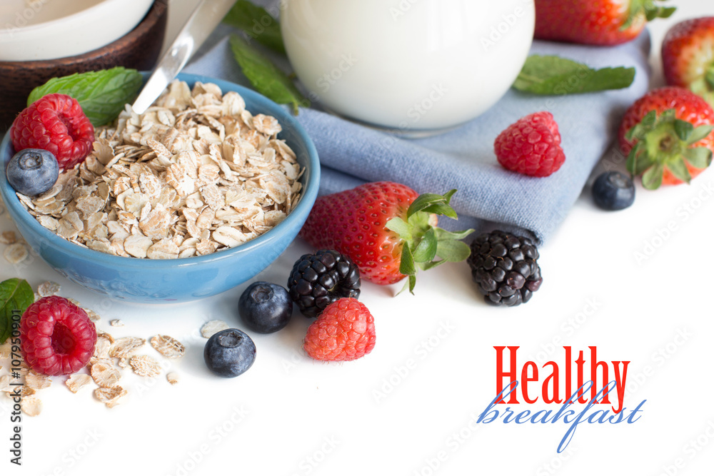 Rolled oats in a bowl with berries and milk Rolled oats in a bowl with berries and milk