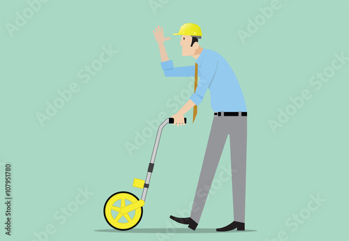 Surveyor measuring distance with surveyor’s wheel.