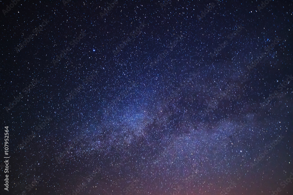 Naklejka premium Milky Way galaxy, Long exposure photograph, with grain.