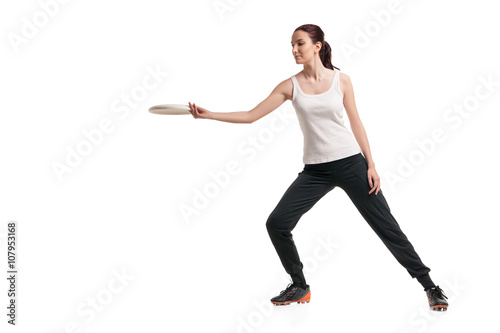 young happy woman playing frisbee over white