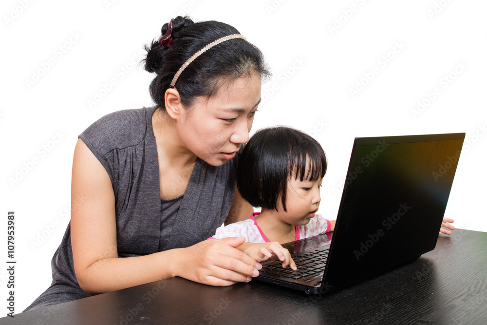 Asian Mother and Daughter Using Laptop Computer