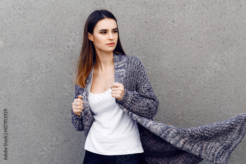 Photos Beautiful girl in a cardigan and shirt outdoor