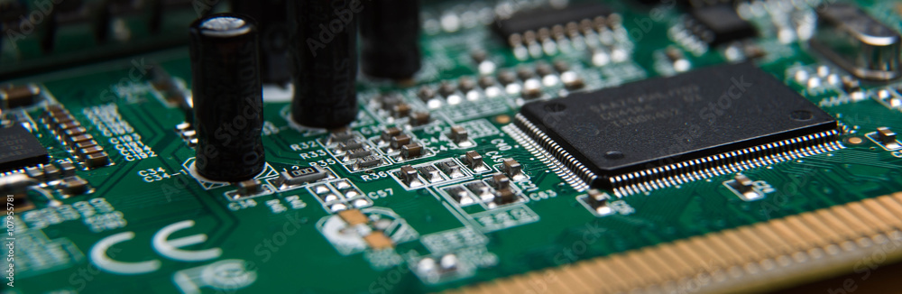 computer circuit Board close up isolated on wooden table computer circuit Board close up isolated on wooden table
