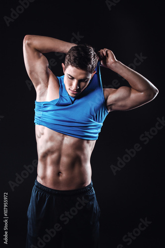 Fitness boy on black background © Friends Stock