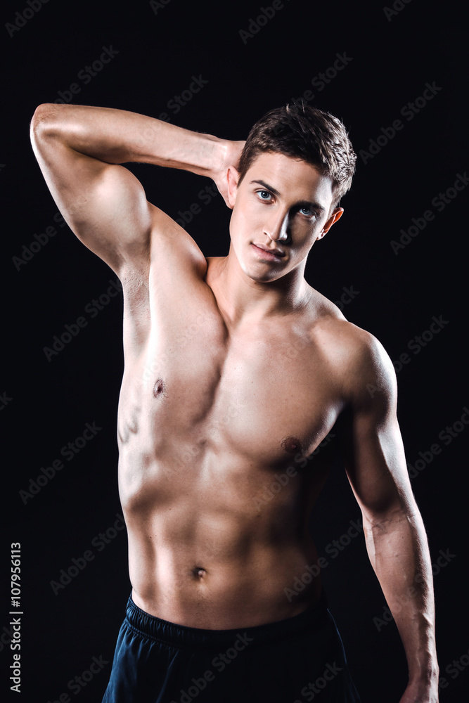 Fitness boy on black background Fitness boy on black background