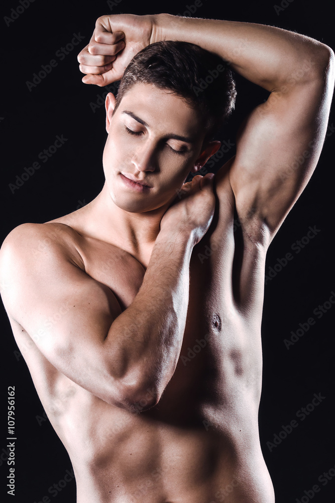 Fitness boy on black background