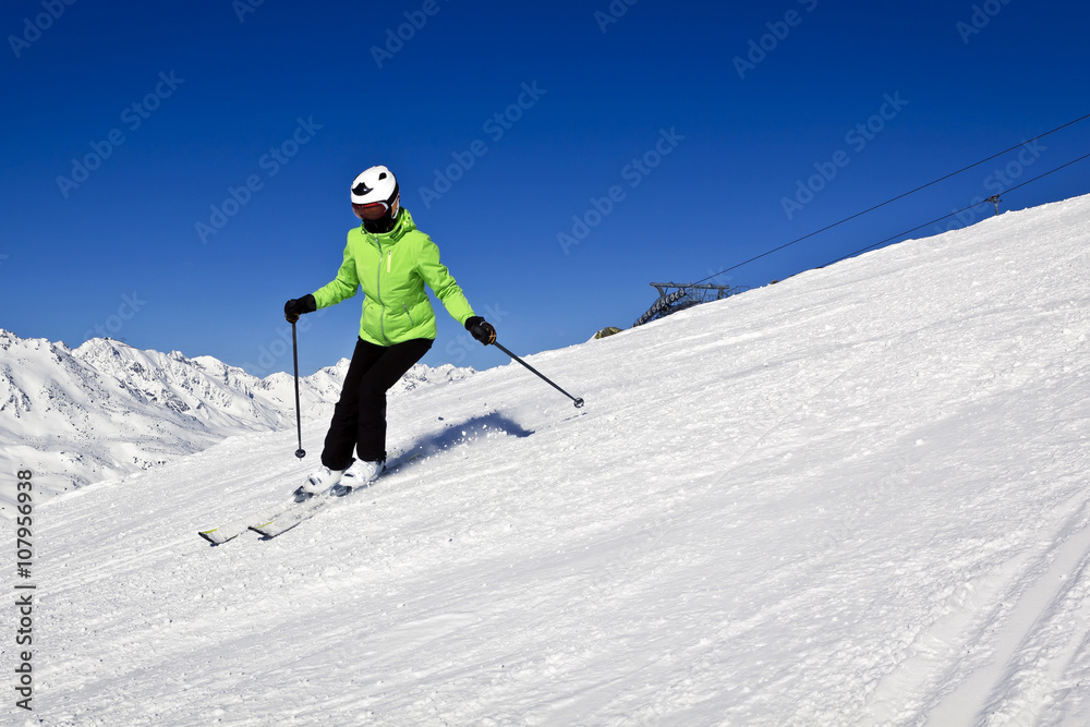 young woman is enjoying winter sports in Austrian Alps