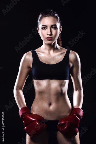 Fitness girl on black background