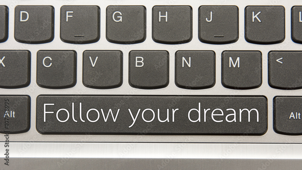 Follow your dream written on large button of keyboard Follow your dream written on large button of keyboard