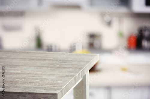 Empty wooden table and blurred kitchen background