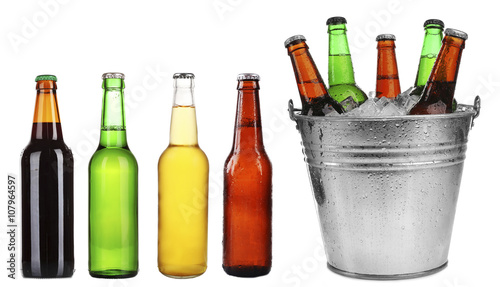 Different types of beer in bottles, isolated on white