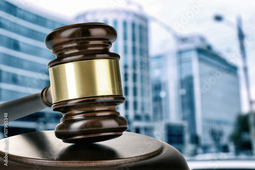 Gavel on building background. Auction concept