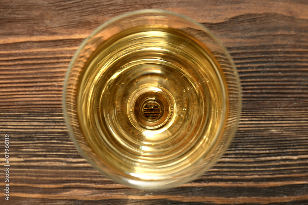 Glass of wine on wooden table. Top view Glass of wine on wooden table. Top view