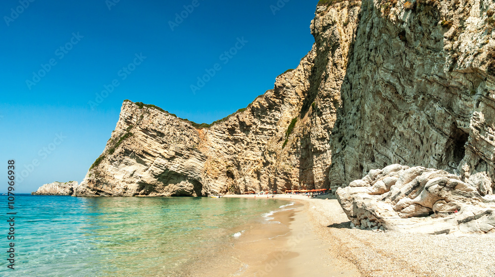 Paradise Beach, Corfu Island, Greece. Paradise Beach is one of the most beautiful beaches in Corfu Island. It is located near Liapades village at south of Paleokastritsa