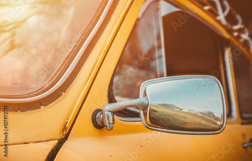 Headlight yellow vintage car.