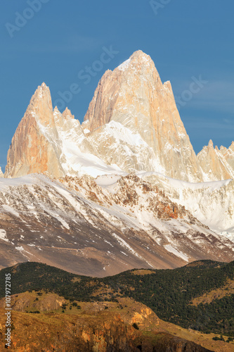 First rays of sun at sunrise over Mount Fitz Roy or Cerro Chalte