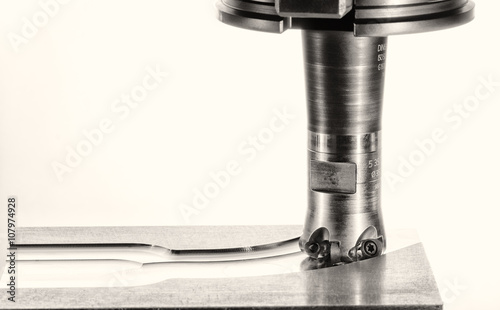 milling cutter work on a white background, monochrome version