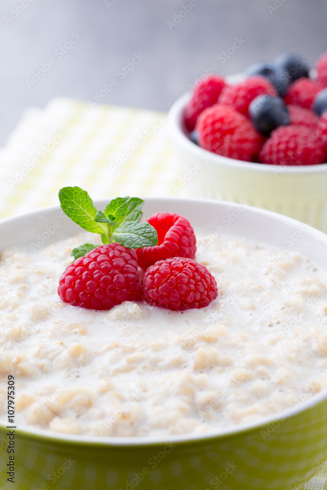 Oatmeal porridge in bowl with berries raspberries and blackberri Oatmeal porridge in bowl with berries raspberries and blackberri