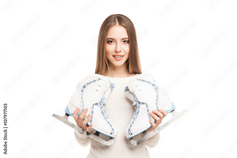 young woman with pair of ice skates isolated young woman with pair of ice skates isolated