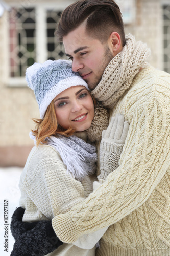 Young couple embracing outd...