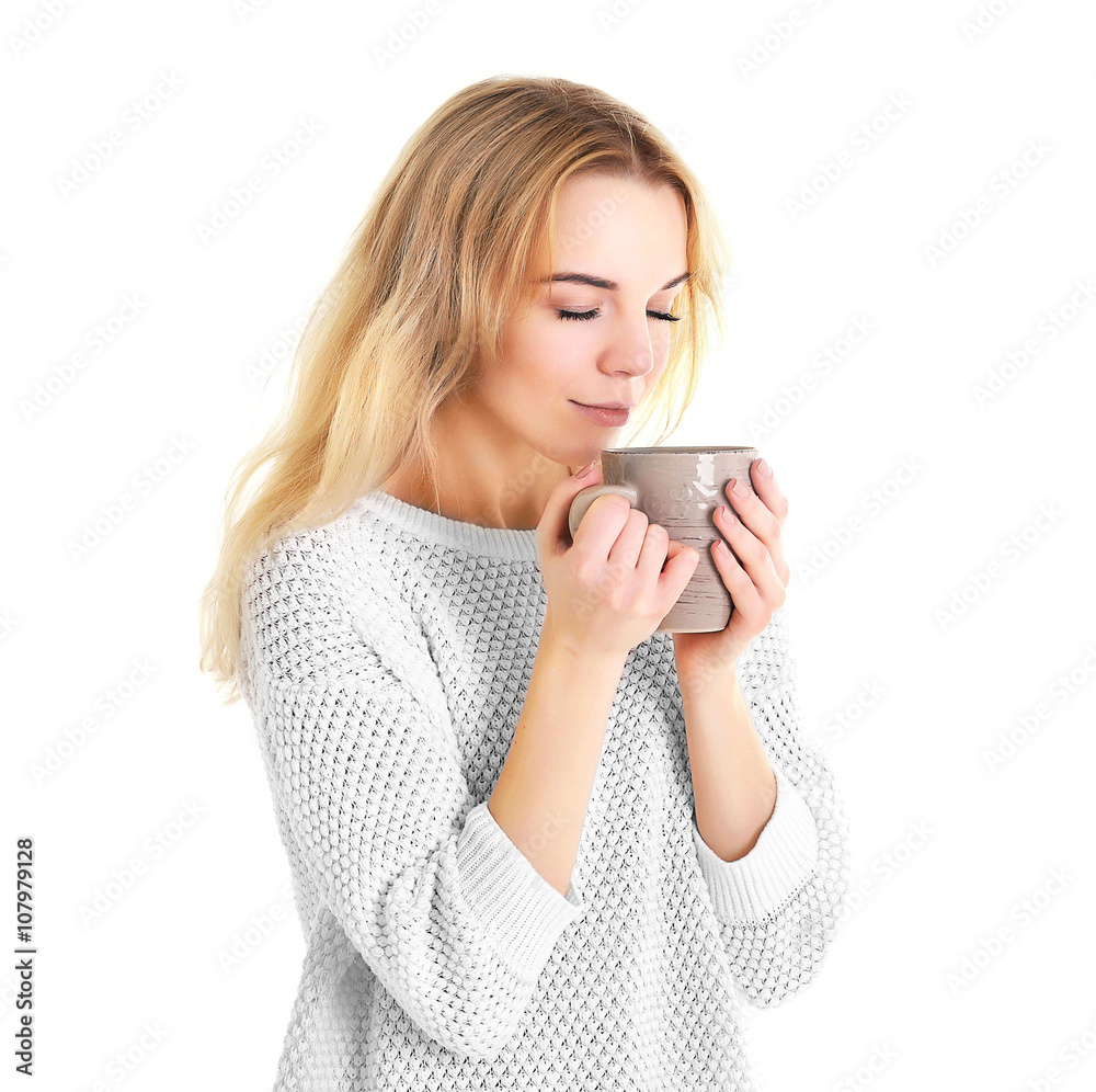 Beautiful girl enjoying a cup of tea, isolated on white Beautiful girl enjoying a cup of tea, isolated on white