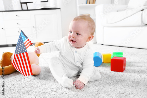 Cute baby boy playing with ...