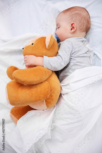 Loving baby with teddy bear...