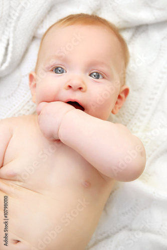 Adorable baby in diaper wit...