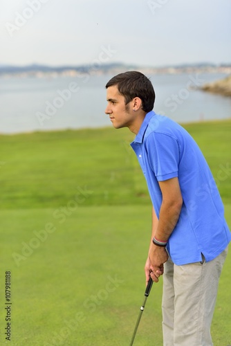 Young man playing golf © avarand