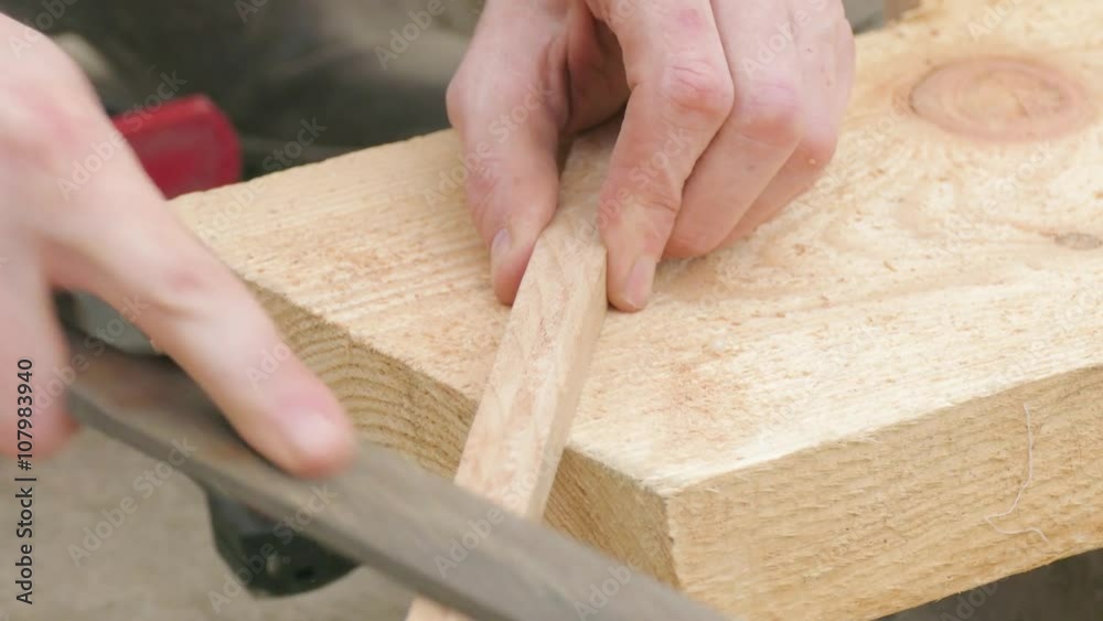 grinding of wooden plank using a rasp grinding of wooden plank using a rasp