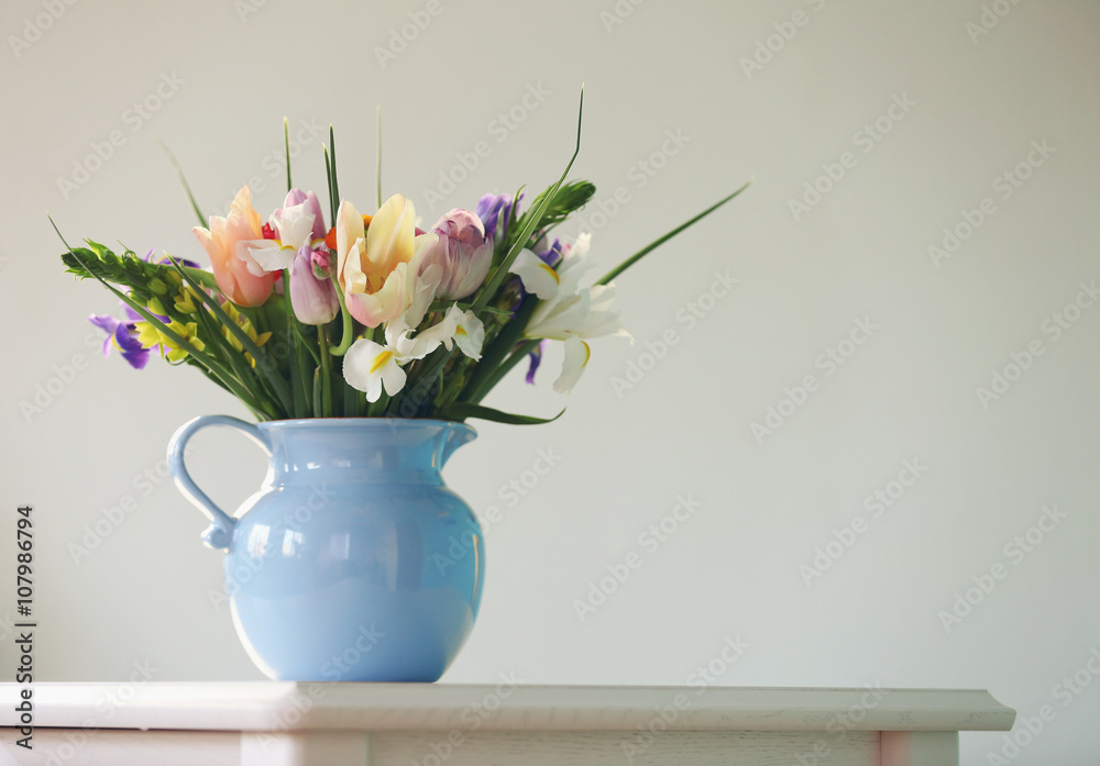 A bouquet of fresh flowers in a vase, close up