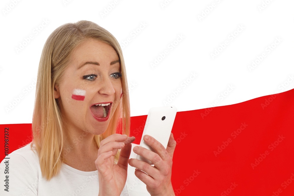 Polish fan cheers football team in the national colors.
