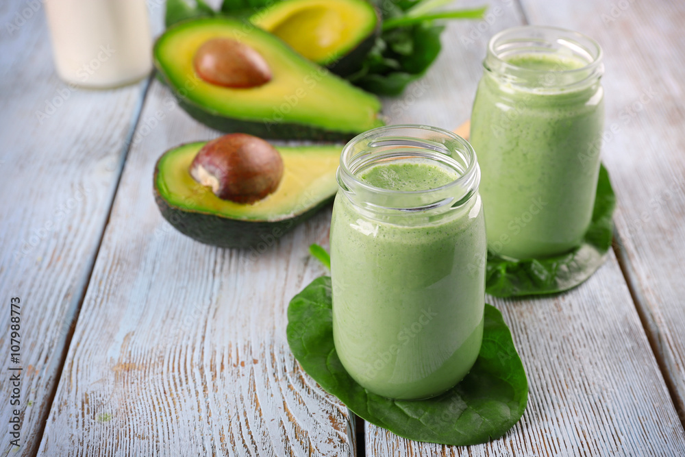 Avocado smoothie on wooden table closeup