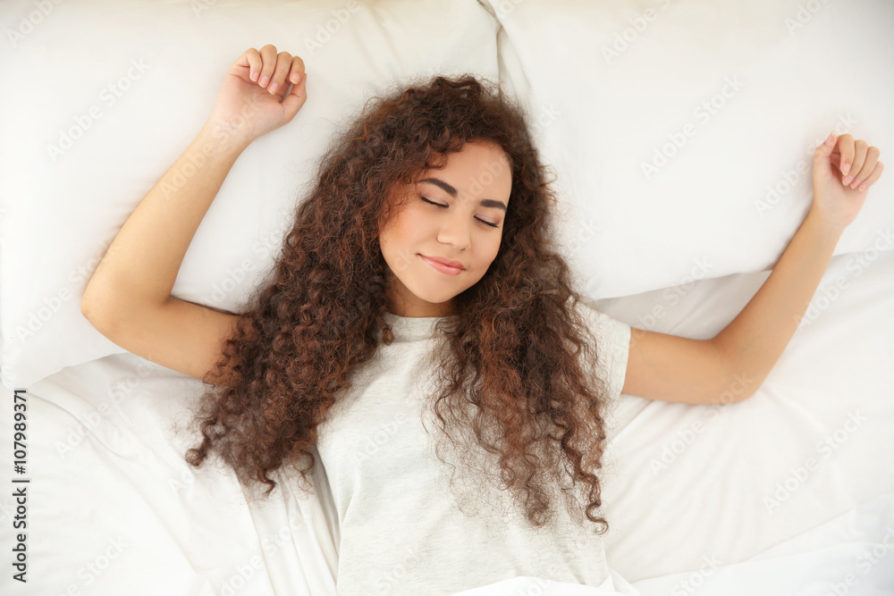 Naklejka premium Beautiful girl sleeping in bed