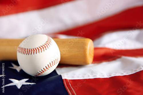 Photography Baseball and bat on background of American flag