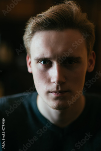 portrait of a young serious guy © lumenphotos