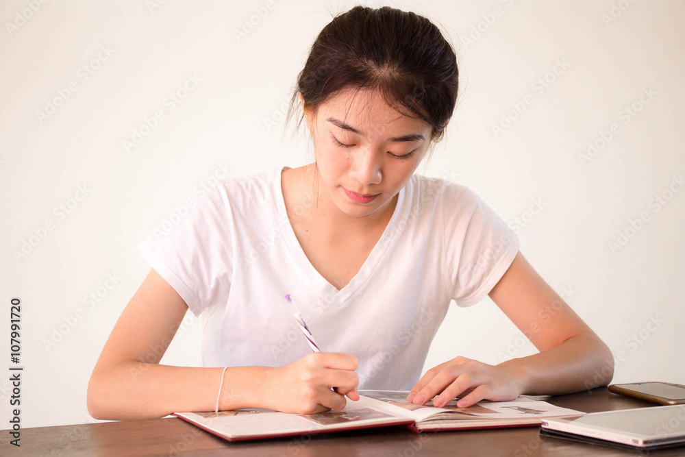 asia thai china student university beautiful girl write a book. asia thai china student university beautiful girl write a book.