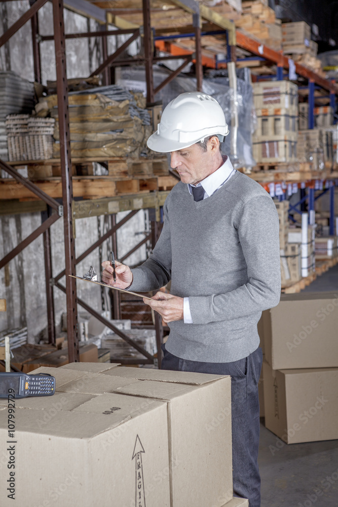 Workers In Warehouse Preparing Goods For shipping