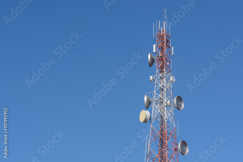 Telecommunication Radio Antenna and Satellite Tower with blue sk