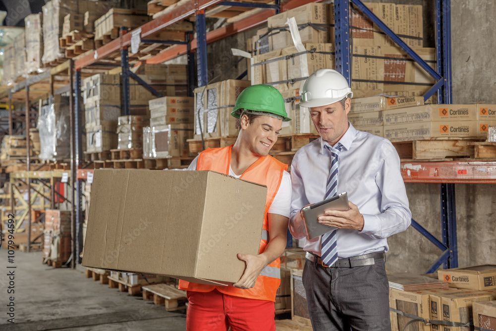 Workers In Warehouse Preparing Goods For shipping Workers In Warehouse Preparing Goods For shipping